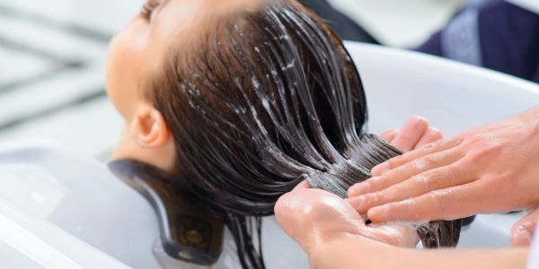 Hair washing salon treatment close up