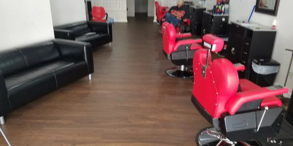 Barbershop interior with red chairs
